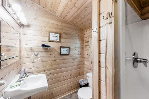 a bathroom with a sink and a toilet at Ruby Peak Haven in Joseph