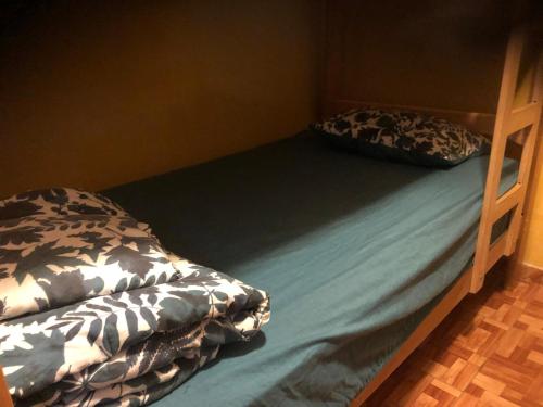 Ένα ή περισσότερα κρεβάτια σε δωμάτιο στο Intihuatana Hostel
