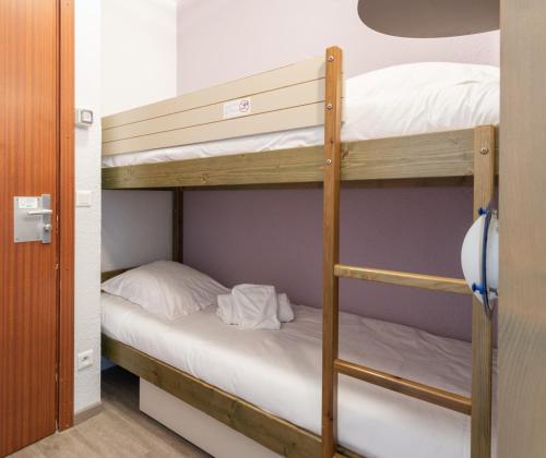 Postel nebo postele na pokoji v ubytování Résidence Pierre & Vacances La Rostagne