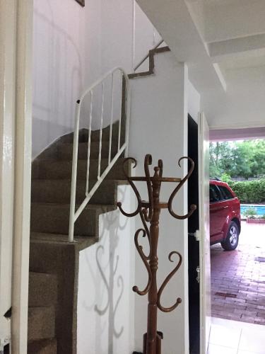 a staircase in a house with a stair railing at Conjunto Buganviles - in Girardot