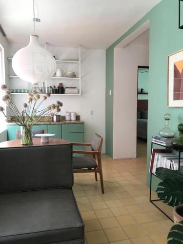a living room with a couch and a table at Mesón San Felipe in Guadalajara