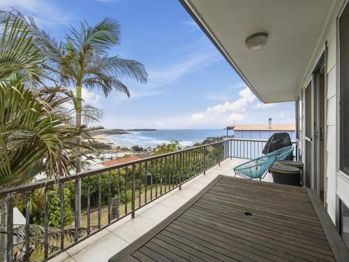 a balcony with a view of the ocean at Emerald Views Signal Street 9 in Emerald Beach