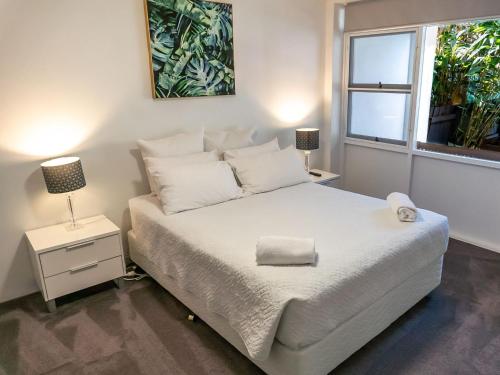 A bed or beds in a room at Sawtell Beachside on 4th #2
