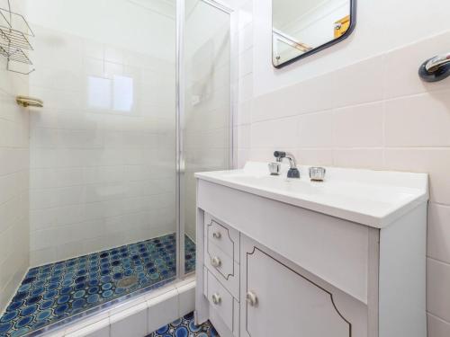 a bathroom with a sink and a shower at Marine Drive 32 in Fingal Bay