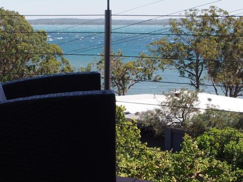 a view of the ocean from the balcony of a house at Pollys View 117A Government Road in Nelson Bay