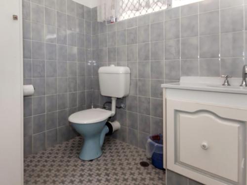 a bathroom with a toilet and a sink at Quarterdeck Unit 3 12 Magnus Street in Nelson Bay