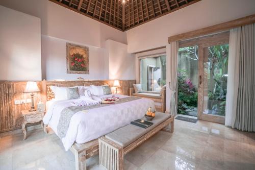 Un ou plusieurs lits dans un hébergement de l'établissement Weda Cita Resort and Spa by Mahaputra