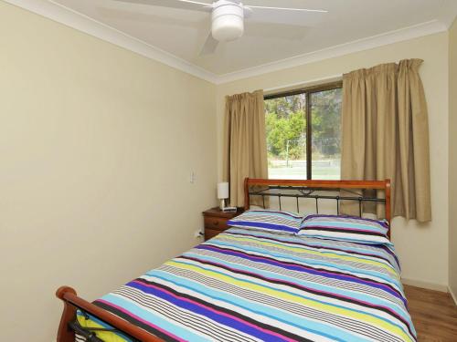 Postel nebo postele na pokoji v ubytování Family Getaway Shoal Bay