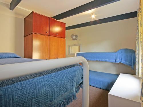 A bed or beds in a room at Matron 17, Narrawallee