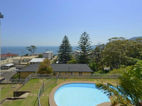 a large swimming pool in the middle of a yard at Sundeck Unit 9 51 Ronald Avenue in Shoal Bay