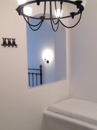 a bathroom with a mirror above a toilet at Panorama Hotel in Naxos Chora