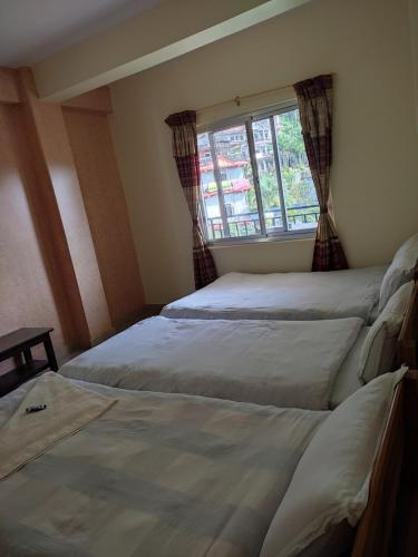 Hotel Green Hill Viewにあるベッド