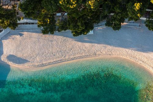 an aerial view of a beach and the ocean at Bluesun Mala Berulia in Brela