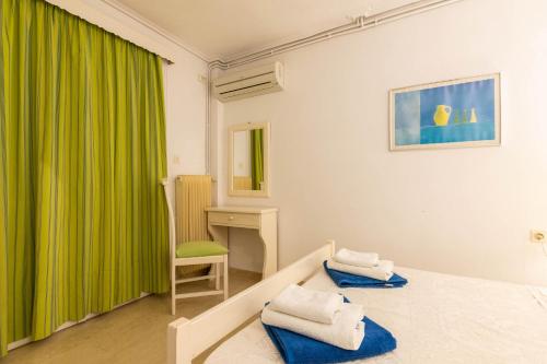 Ένα ή περισσότερα κρεβάτια σε δωμάτιο στο Lenna's Villas Zante
