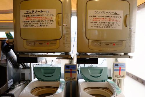 a group of three toilets in a store at Hotel Check In Shimbashi in Tokyo