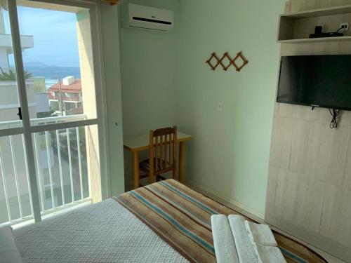 Ein Bett oder Betten in einem Zimmer der Unterkunft Praia Pousada Tatuíra