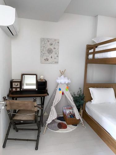 a bedroom with a desk and a bed and a deskablish at Veranda Residence Hua-Hin in Hua Hin