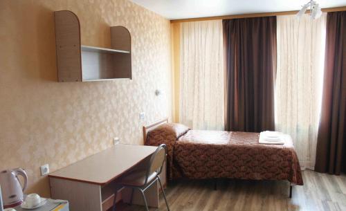 Posteľ alebo postele v izbe v ubytovaní Uchebnaya Hotel