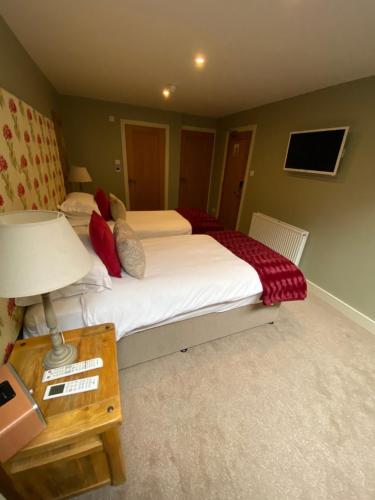 The Peppermill Town house Hotel & Restaurantにあるベッド