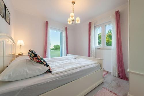 Un pat sau paturi într-o cameră la Villa Tatijana
