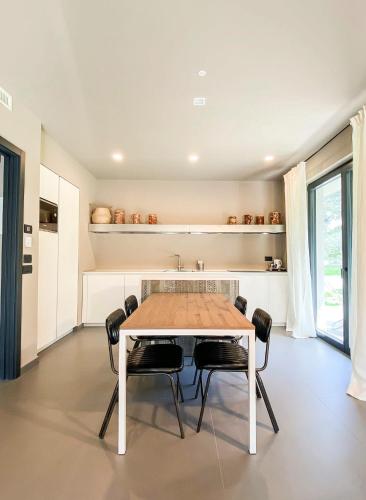 a dining room with a table and chairs at Gazzi Apartments 'Panoramic & Relaxing' in Arco