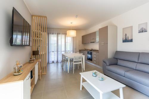 a living room with a couch and a table at Isola di Albarella in Isola Albarella