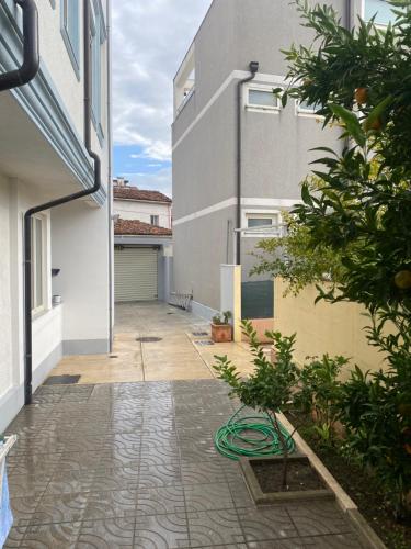 an empty courtyard of a house with a building at Eagle’s Nest in Shkodër