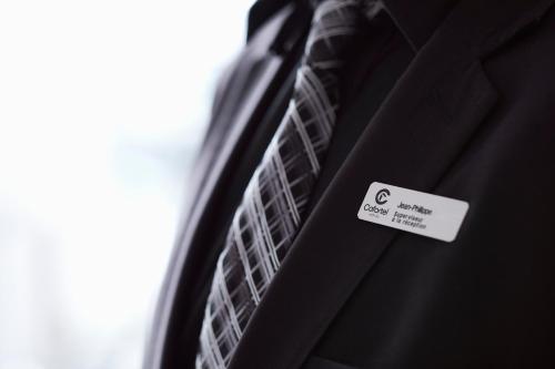 a close up of a black suit with a tie at Hôtel Cofortel in Quebec City