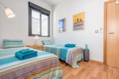 Posteľ alebo postele v izbe v ubytovaní Jinetes Penthouse in Malaga by Solaga Holiday Homes