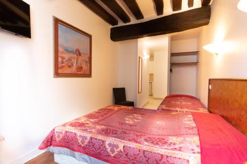 Postel nebo postele na pokoji v ubytování Résidence de Bourgogne