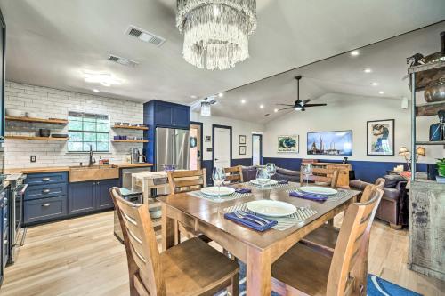 a dining room and kitchen with a table and chairs at Dripping Springs Cabin with Pool, Hill Country Views in Dripping Springs