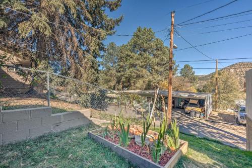 a yard with some plants and a truck at Cabin with Mountain Views about 2 Mi to Ruidoso Midtown! in Ruidoso