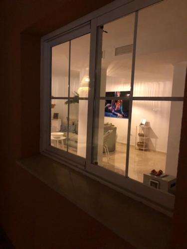 a view of a living room through a window at Center beach 2 beds Appartement Elviria in Marbella