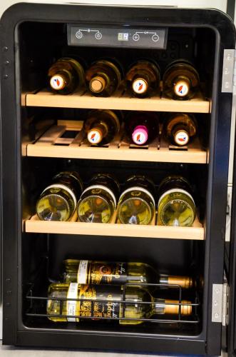 an open refrigerator filled with lots of wine bottles at Apartmán u Vítka in Mikulov