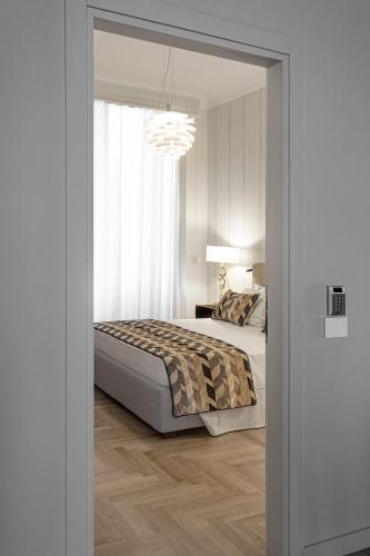 Ein Bett oder Betten in einem Zimmer der Unterkunft Apollo Suite