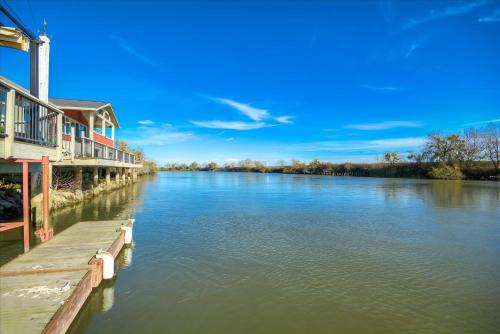 a view of a river with houses and condos at Year-round fishing, boating, birding, 1 hr from SF in Walnut Grove