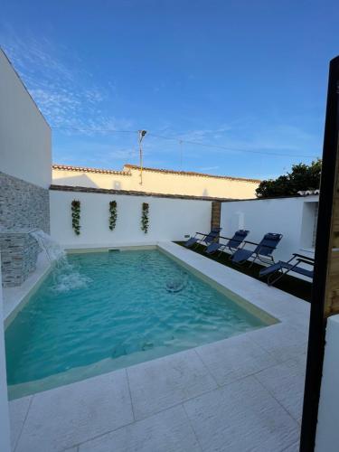 a swimming pool on the roof of a house at Casa da Matriz in Vidigueira