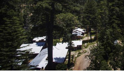 an aerial view of a house in the trees at The Cabins at Cloudcroft in Cloudcroft