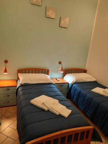 Un ou plusieurs lits dans un hébergement de l'établissement Au Jardin de Florence