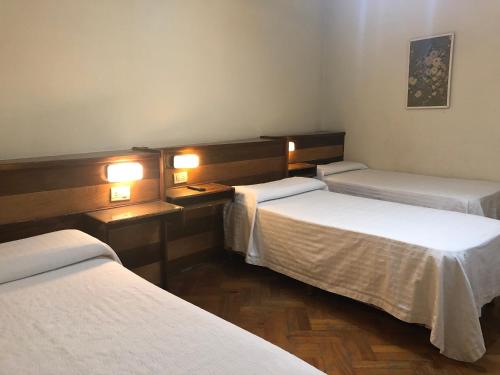 Cama ou camas em um quarto em Palace Hotel Mendoza
