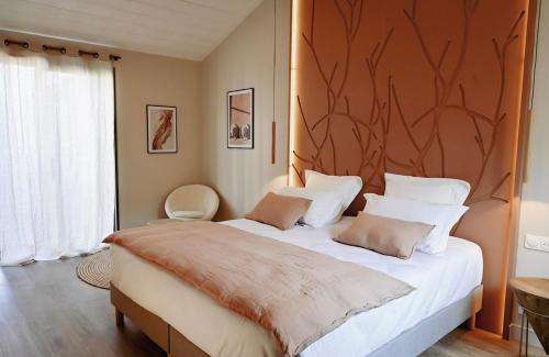 Ένα ή περισσότερα κρεβάτια σε δωμάτιο στο L'envie