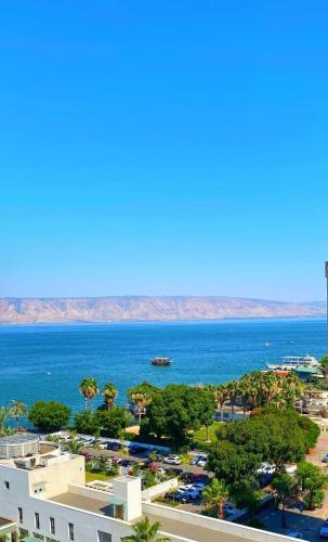 a view of the ocean from the balcony of a resort at טבריה in Tiberias
