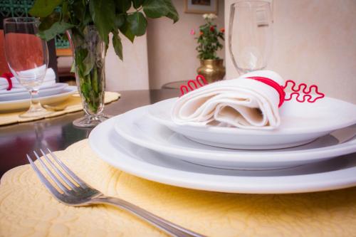 a table with a plate of food on a table at Riad Inaka in Marrakech