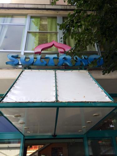 awning of a building with a sign on it at Hotel Sultano in Rimini
