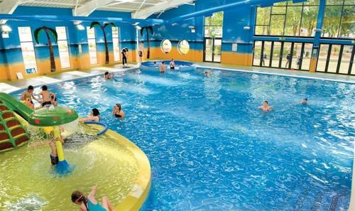 a group of people in a swimming pool at Billing Aquadrome in Great Billing