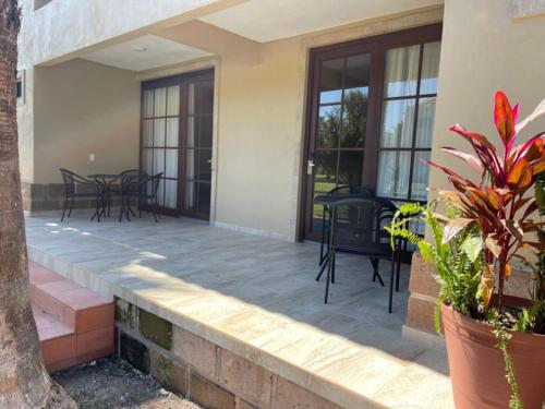 a patio with chairs and tables on a house at Posada Campestre Tasquillo in Tasquillo