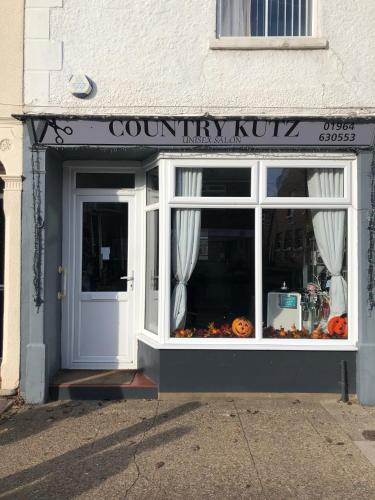 a store front with a pumpkin king sign in the window at Number One - Fully Equipped Self Catering Four Bedroom House next to Dunedin, 15 mins to Spurn, 20 mins to Saltend, 12 mins to Easington in Patrington