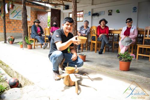 a man sitting in front of a group of people at YUMBILLA ECO LODGE in Cuispes