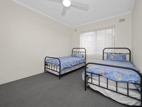 Tempat tidur dalam kamar di Parklea Unit 9