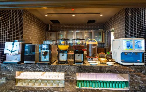 a kitchen with a counter with various appliances on it at Kenting Long Beach Hotel in Checheng